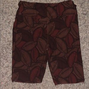 lulaRoe leggings with a football pattern